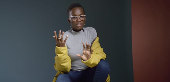 Screenshot of video with a women speaking to the camera.
