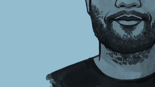 A cross section of an illustration of the author's face, with beard and moustache and a smile, against a blue background.